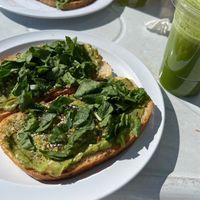 Avocado toast and green juice   at Atomic Cafe in Beverly