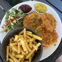 Celery schnitzel with fries and salad  at Munich in Lagos