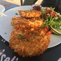Celery schnitzel with greens and cold potato salad at Munich in Lagos