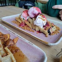 Strawberry cheesecake waffles, chocolate and strawberry sauces, biscoff crumbs, cream and strawberry ice cream (vegan) at Out-there Artisan in Jedburgh