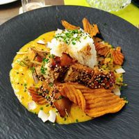 Vegan lentil stew with grilled Tofu skewer, rice and vegetable chips at Kartausenkeller in Gaming