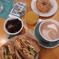 Brunch with hot chocolate, granola bowl, juice, "chicken"-avocado bagel and mocca-hazelnut donut at ROUND - Helsinginkatu in Helsinki