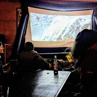 Movie night in the courtyard area where the food truck is located at 1874 Food Truck in Del Norte