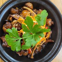 Pilze mit Weinsoße und Knoblauch at The Butterfly Lovers in Berlin