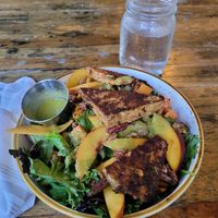 Spectacular! SOUTHERN BELLE SALAD (with tempe minus chees and honey) e**

Choice of grilled protein over spring greens with fresh peaches, roasted sweet potatoes, candied pecans an at The Floridian in St Augustine