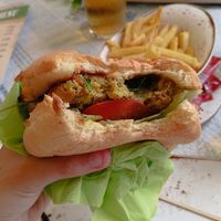 The burger comes with 2 patties and cheese. And we added ketchup ourselves. Could have more salad, but it was nice anyway. at Bistro 23 Four in Gozo