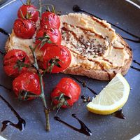 Hummus and roasted balsamic tomato on toast at Laughing Dog in Brighton