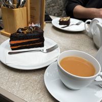 Chocolate orange cake and brownie opposite, both vegan! With a cup of tea with oat milk  at Peveril Tea Room in Hope Valley