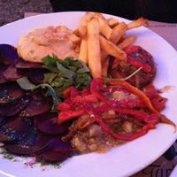 Hummus, beet carpaccio, escalivada, salad, fries and stuffed mushrooms at Faristol in Altafulla
