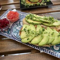 Toast with avocado and tomato   at REVIV in Malaga