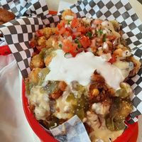 Giant totchos, very fresh pico de gallo, green chilis, "cheese", chilj at Vegan Junk Food in Portland