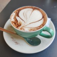 Cappucino with oat milk at Fusion Café y Panaderia in San Sebastian