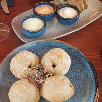Bottom to top: empanadas, olive bread with 3 sauces, dumplings (all vegan) at From Heaven in Bad Ragaz
