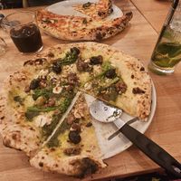 Vegan stilton, fig, broccoli and walnut pizza and apple mocktail at Slow Rise Pizza in Lincoln