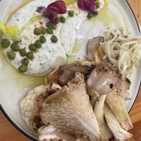Cauliflower steak with chanterelles mushrooms, fennel Cole slaw, and even edible snapdragon flowers.  at Grajska Plaža in Bled