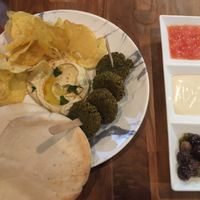 Tester plate : falafel, houmous, chips, pita, olives and sauces at Push Tak in Lisbon
