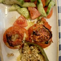 Rice stuffed green pepper and tomatoes and salad.  Had eaten half the pepper (and all the fava bean dip) before I took the photo. at Mykonos in Cospicua