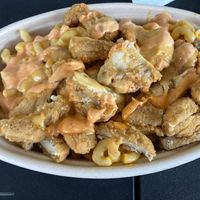 Vegan McClucker Fries (fries loaded with mac and cheese, boon sauce and vegan tender) at Boon Cafe in Norridge