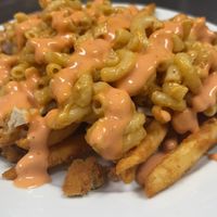 Vegan
Mc Clucker fries
Fries topped with vegan [inhouse made] mac & cheese & vegan tenders at Boon Cafe in Norridge