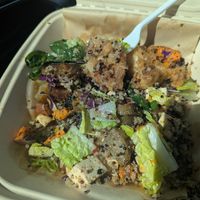 Buddha bowl mixed up and a bite already taken, I couldn't wait lol. at Gather Cafe Bistro Bar in Talent