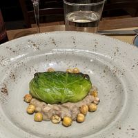 Stuffed cabbage roulade with mushrooms and chickpeas  at Il Rovescio in Bologna