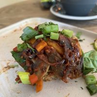 A half eaten vegan and hummus on toast  at Olive in Thurso