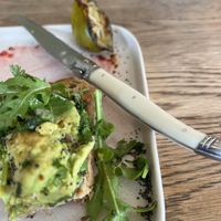 Another half eaten avocado on toast  at Olive in Thurso