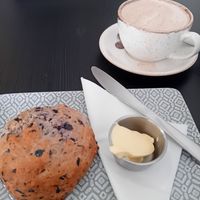 Blueberry vg scone with d/f spread and vg salted caramel hot chocolate at Reggie's Cafe in Whitley Bay