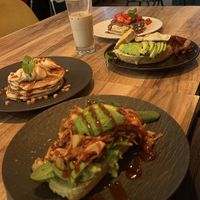 Vegan pulled jackfruit toast, vegetarian caramel banana pancakes, non vegan toast (bacon and egg) and vegetarian Nutella strawberry pancakes   at Mr NonNo - Center in Rotterdam
