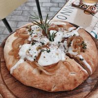 Focaccia Toscana with onions and vegan cheese  at Amaranto Bistrot in Finale Ligure