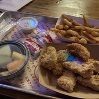Kids meal with 5 chikn nuggets (blue spot is a disco light reflection!) Perfect portion for this grown lady    at Happy Chicks in Austin