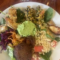 Potato wedges, black beans, falafel, hummus, salad, bulgur...  at Cafe Hangmattan in Gothenburg