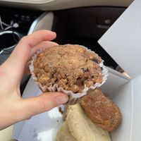 Blueberry & walnut coffee cake muffin; below are a lemon cookie, sour cream & chive scone, apple bundt cake, and a strawberry rhubarb oat bar 😋   at Wildflour Vegan Bakery and Juice Bar in Pawtucket