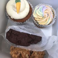 Carrot cake cupcake, pride cupcake, award winning cookies at Wildflour Vegan Bakery and Juice Bar in Pawtucket