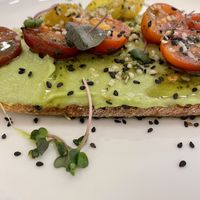 Yummy avocado & tomato toast! at Yum Baaar in Segovia