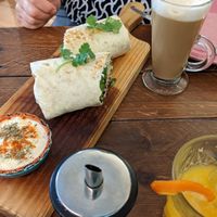Wife's vegan burrito and almond milk latte... She approves 😁 at Break Sé in Lisbon
