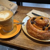Oat latte and vegan pain aux raisins as big as my head  at The Press Room in Surbiton