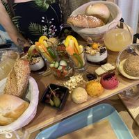 vegan breakfast spread including 3 types of hummus, veggies, granola, bread, tofu, juice and Knödel  at Coolinarik in Salzburg