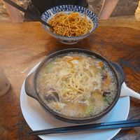 Mushroom broth in a casserole pot with vegetables and noodles - 20rmb, vegan at Shi Zhiqian - 释之谦 - Maybe closed in Dali