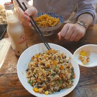 Front: 菌王炒饭 jùn wáng chăo fàn - a fried rice with a variety of chopped up vegetables in it including sweetcorn, carrot and celery. Absolutely delicious. 20rmb

Back:  at Shi Zhiqian - 释之谦 - Maybe closed in Dali