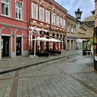 The ice cream shop (with the white umbrellas) in Novi Sad, along the pedestrian street. at Chocolato Cafe in Novi Sad