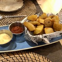 Patatas bravas (salsa blanca no vegana)  at Ordesa 88 in Ainsa