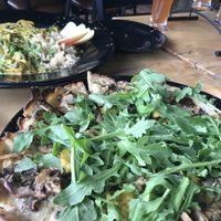 Mushroom flatbread and yellow curry with a kombucha flight!  at Julia's Vegetarian Restaurant in Pacific Grove