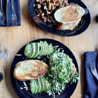 Avocado and toast and breakfast sandwich plates both vegan   at Julia's Vegetarian Restaurant in Pacific Grove