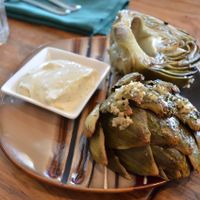 super delicious Roasted Artichoke  - Roasted globe artichoke served with a vegan garlic & lemon aioli at Julia's Vegetarian Restaurant in Pacific Grove