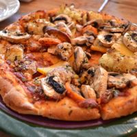 Julia’s Pizza - vegan on request - Roasted vegetables, mozzarella, mushrooms. at Julia's Vegetarian Restaurant in Pacific Grove