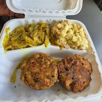 Potato salad, coconut curry cabbage, crab cakes at The Land of Kush in Baltimore