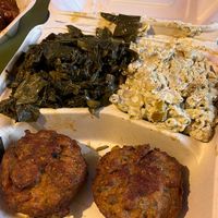 Crab cakes, collard greens and seafood Mac n cheese  at The Land of Kush in Baltimore