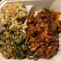 Collards, mac, & bbq ribs. Fantastic!  at The Land of Kush in Baltimore