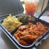 BBQ ribs, potato salad, collard greens & sweet teaa  at The Land of Kush in Baltimore